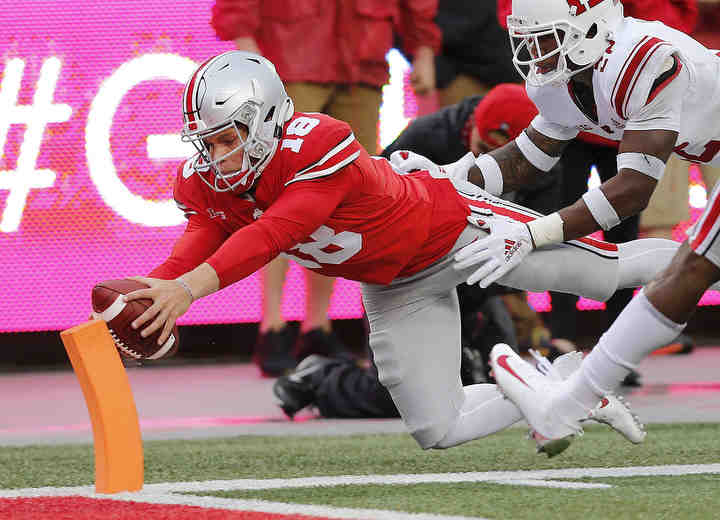 Ohio State Buckeyes quarterback Tate Martell (18) scores on a 47 yard touchdown run during the fourth quarter of the NCAA football game between Ohio State and Rutgers at Ohio Stadium on Saturday, September 8, 2018.   (Jonathan Quilter / The Columbus Dispatch)